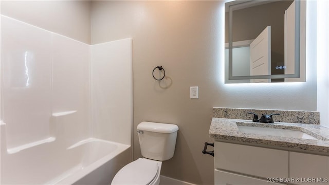 full bathroom featuring bathtub / shower combination, vanity, and toilet