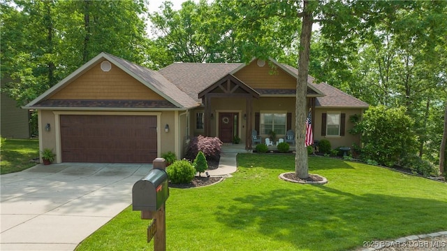 craftsman-style house featuring a garage and a front yard