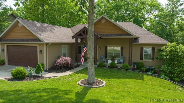 view of front of house featuring a front yard and a garage