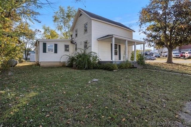 view of property exterior with a yard and a porch