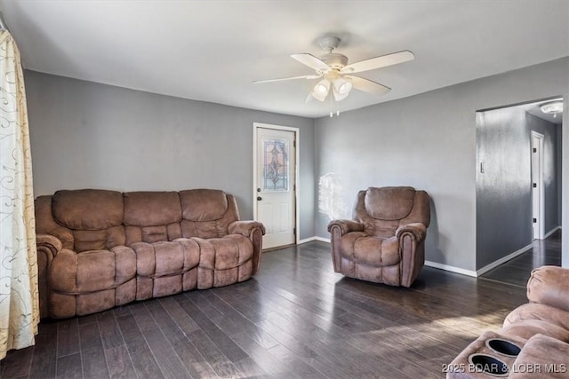 living room with ceiling fan and dark hardwood / wood-style floors