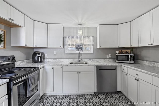 kitchen featuring sink, white cabinets, and appliances with stainless steel finishes