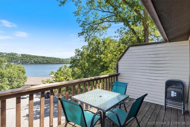 wooden deck with a water view