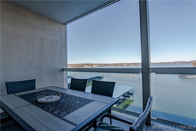 balcony featuring a water view