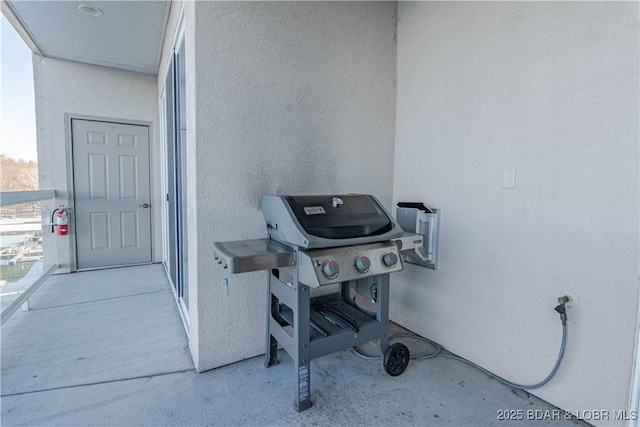 view of patio with a balcony and grilling area