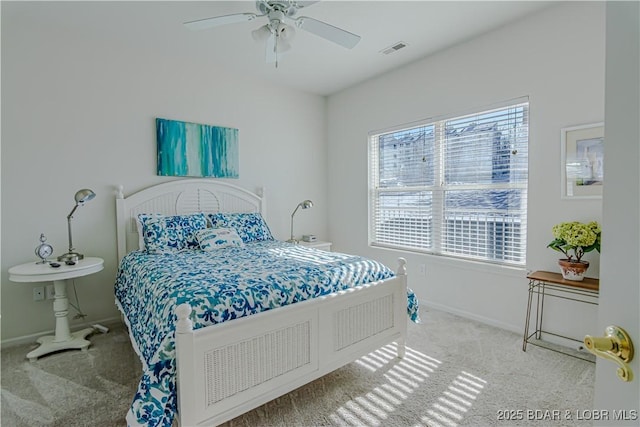 carpeted bedroom with ceiling fan