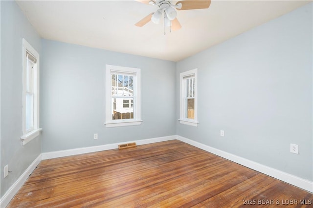 unfurnished room featuring ceiling fan and hardwood / wood-style floors