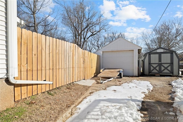 exterior space with a garage and a shed