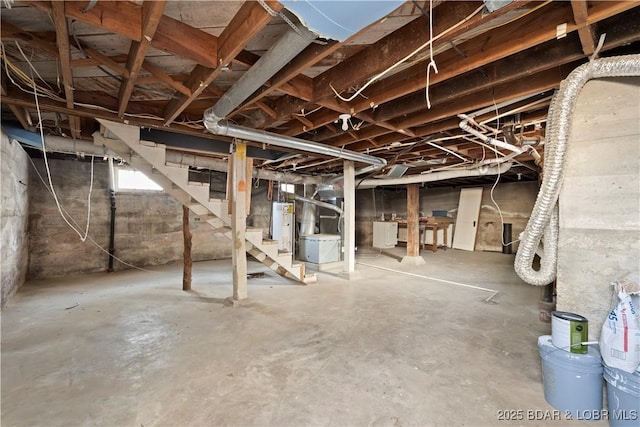 basement with gas water heater and heating unit