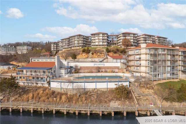 view of building exterior with a water view