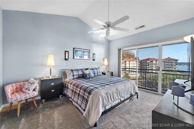 carpeted bedroom featuring ceiling fan, a water view, vaulted ceiling, and access to exterior