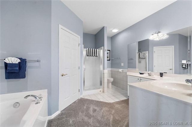 full bathroom with toilet, vanity, tile patterned flooring, and independent shower and bath