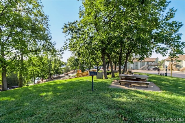 view of community featuring a lawn