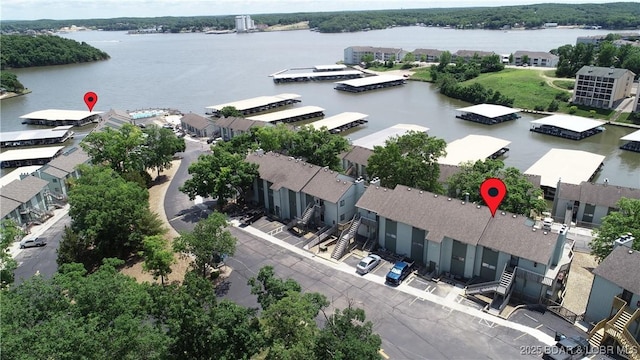 birds eye view of property with a water view