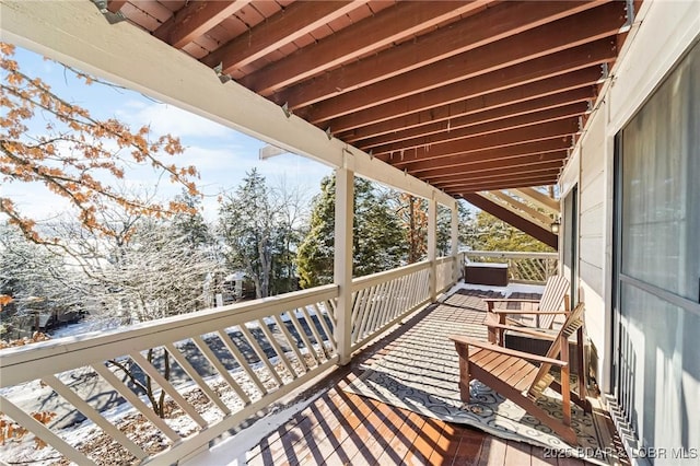 view of snow covered deck