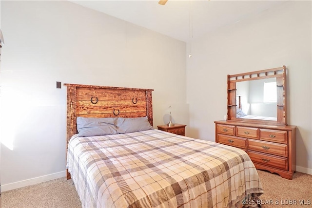 bedroom with light carpet and ceiling fan