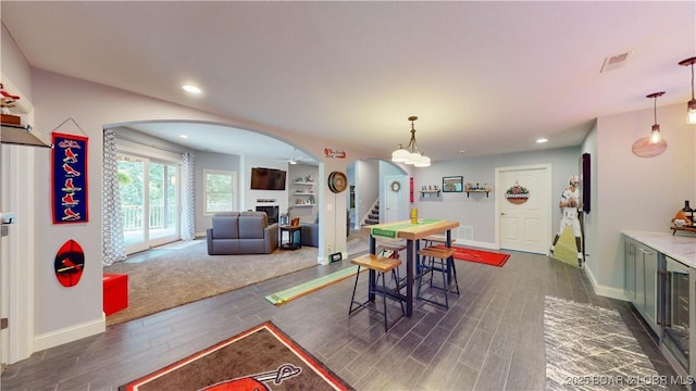 dining space with dark wood-type flooring