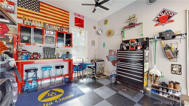 recreation room with lofted ceiling and ceiling fan