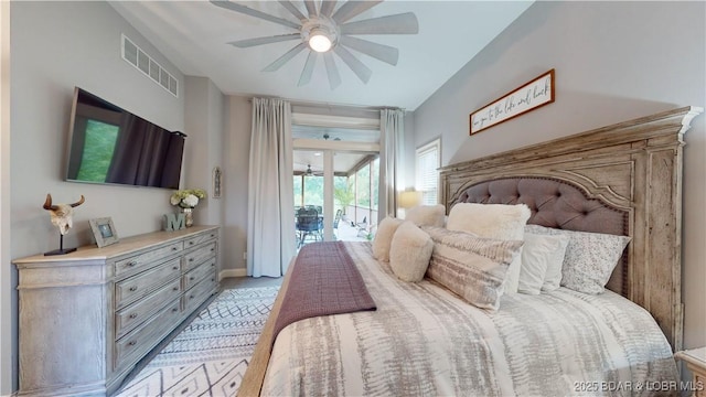 bedroom with baseboards, access to outside, visible vents, and a ceiling fan