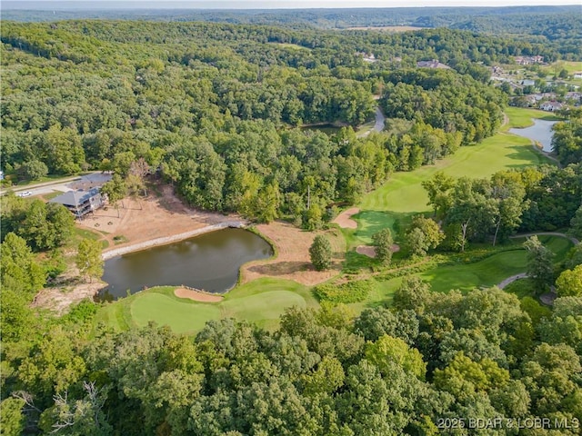 aerial view with a water view, view of golf course, and a view of trees