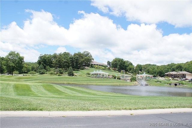 surrounding community featuring a water view