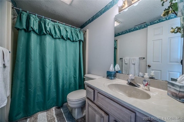 bathroom featuring a textured ceiling, toilet, a shower with curtain, and vanity