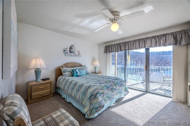 carpeted bedroom featuring ceiling fan, access to exterior, and a textured ceiling