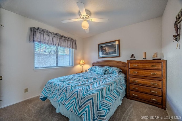 bedroom with ceiling fan and carpet floors