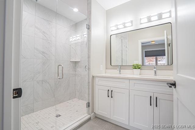 bathroom with vanity and an enclosed shower