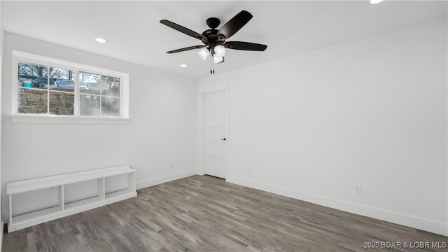 spare room featuring ceiling fan and hardwood / wood-style flooring