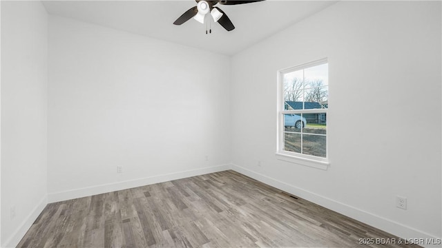 unfurnished room with light wood-type flooring, ceiling fan, and a healthy amount of sunlight