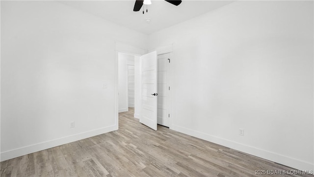 empty room with light wood-type flooring and ceiling fan