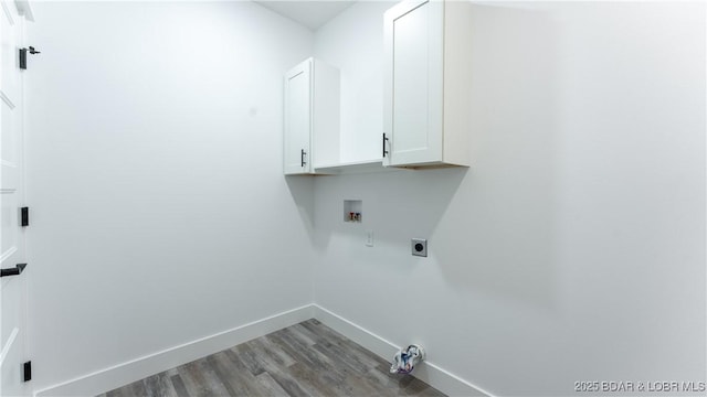 laundry room with cabinets, light hardwood / wood-style floors, hookup for a washing machine, and electric dryer hookup