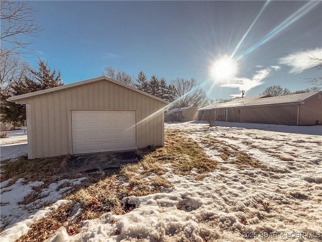 view of snow covered garage