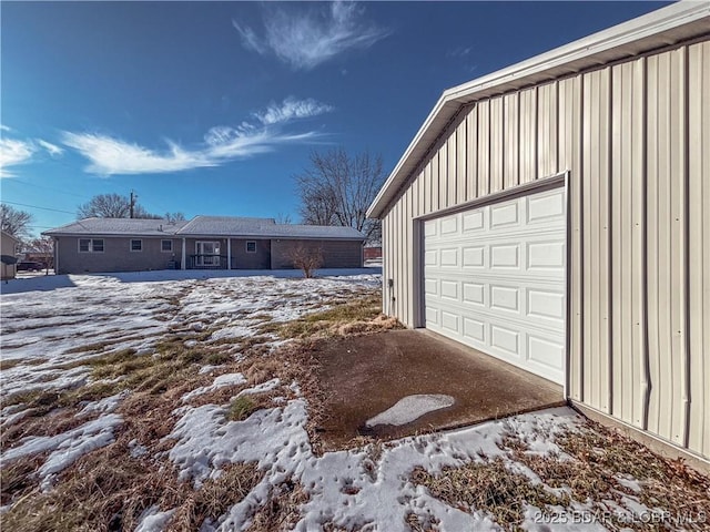 view of snow covered garage