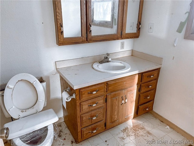 bathroom with toilet and vanity