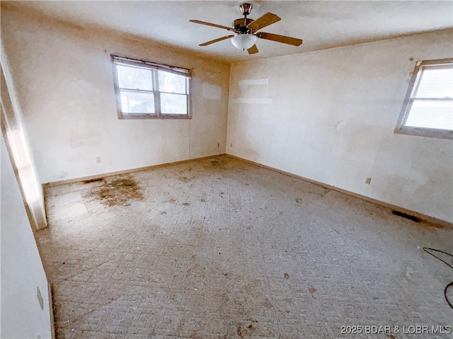 empty room featuring ceiling fan