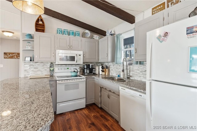 kitchen featuring white appliances, dark hardwood / wood-style flooring, vaulted ceiling with beams, light stone counters, and sink