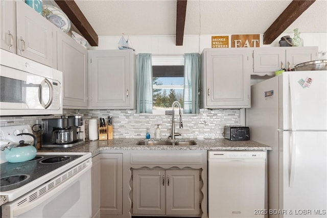 kitchen featuring sink, white cabinets, tasteful backsplash, and white appliances