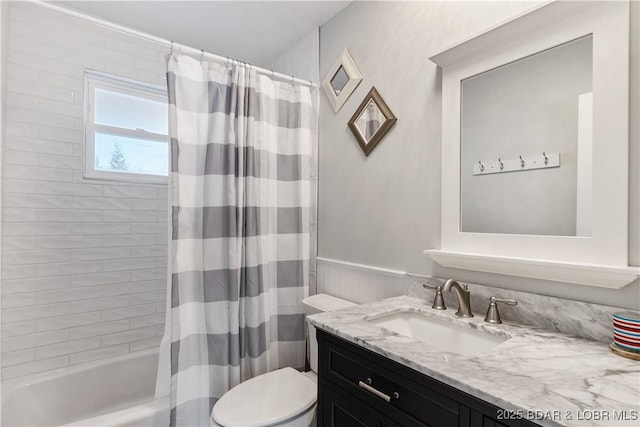 full bathroom with toilet, vanity, and shower / bath combination with curtain