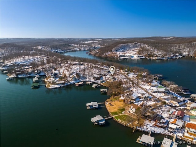 birds eye view of property featuring a water view