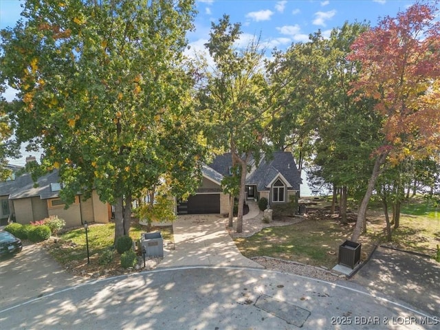 obstructed view of property with a garage