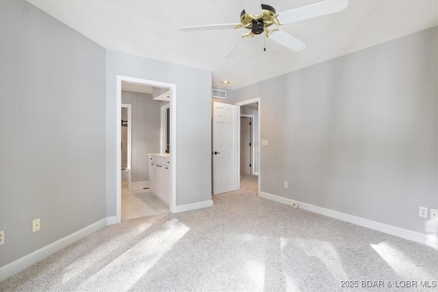 unfurnished bedroom with ceiling fan and ensuite bathroom