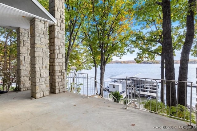 view of patio featuring a water view