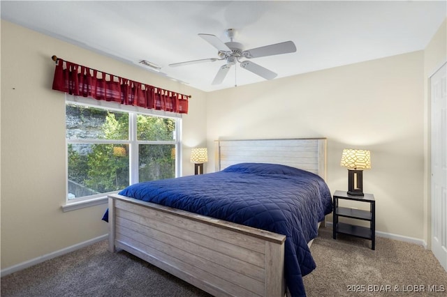carpeted bedroom featuring visible vents, baseboards, and ceiling fan