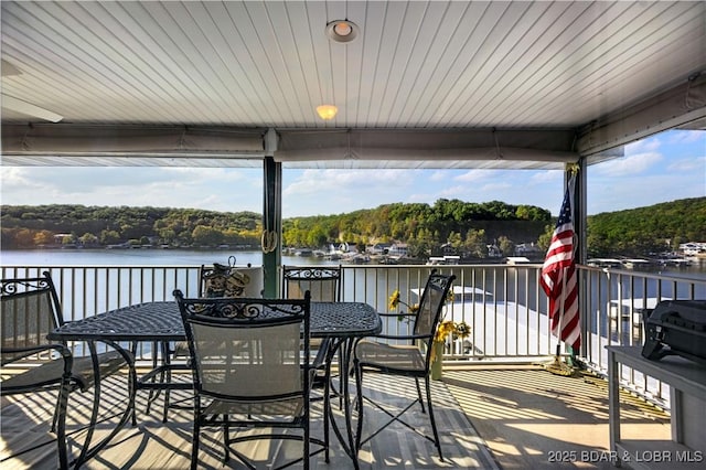 wooden deck featuring a water view