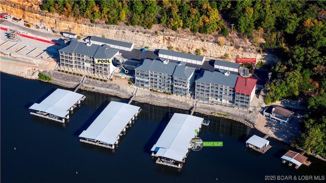 birds eye view of property featuring a water view