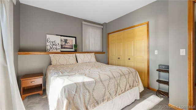 bedroom featuring light carpet and a closet