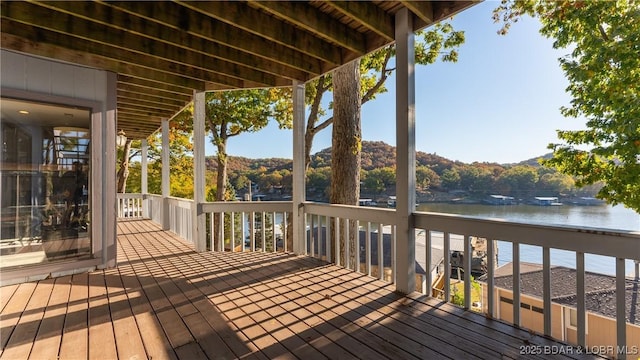 wooden deck with a water view