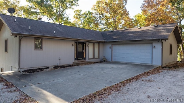 single story home featuring a garage